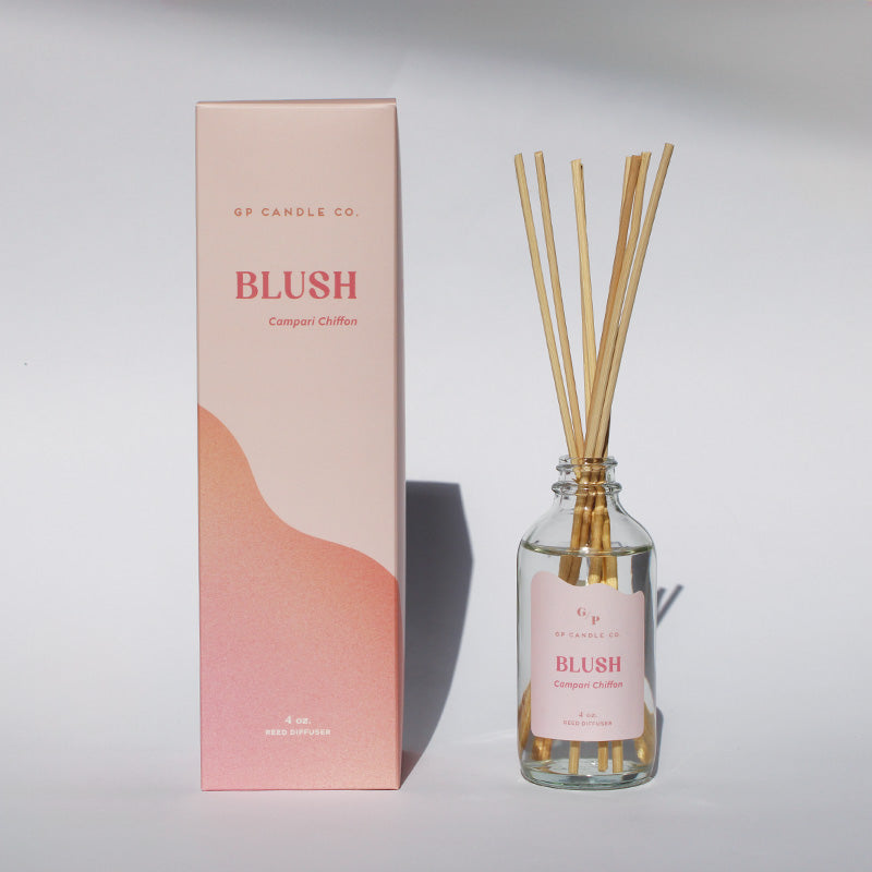 Glass reed diffuser bottle labeled 'Blush' by GP Candle Co. with a matching box set against a white background.
