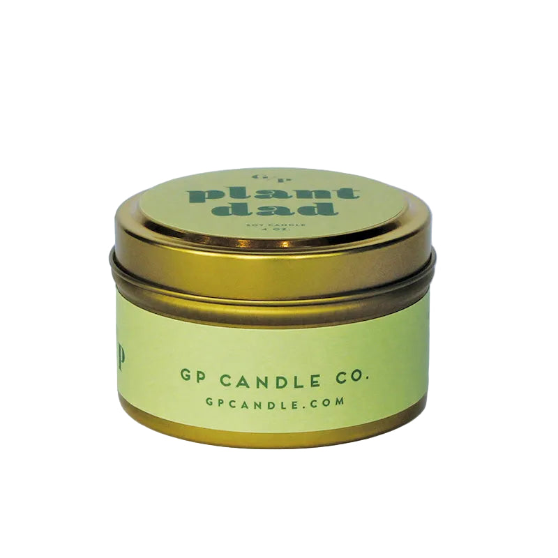Sideview of 4 oz. green candle tin with gold lid featuring 'plant dad' text and GP Candle Co. logo on the side.