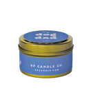 Sideview of 4 oz. purple candle tin with gold lid featuring 'dog dad' and GP Candle Co. logo on the side.