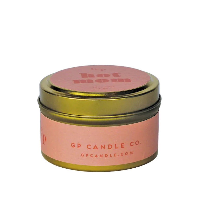 Sideview of 4 oz. pink candle tin with gold lid featuring 'hot mom' and GP Candle Co. logo on the side.
