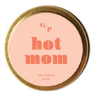 Top view of pink candle tin lid with 'hot mom' text and gold rim.