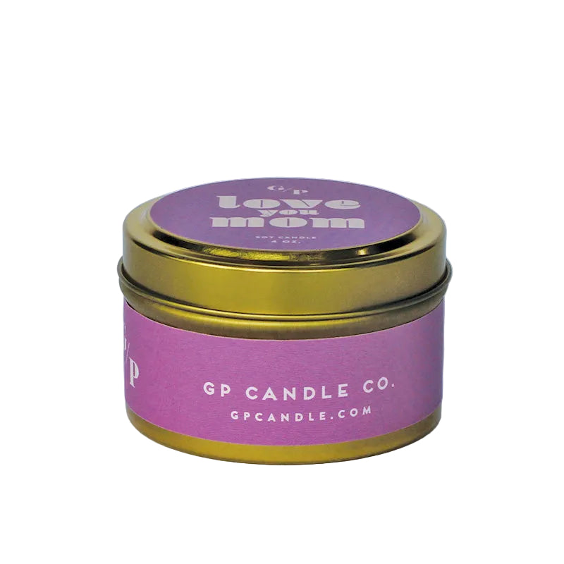 Sideview of 4 oz. pink candle tin with gold lid featuring 'love you mom' text and GP Candle Co. logo on the side.
