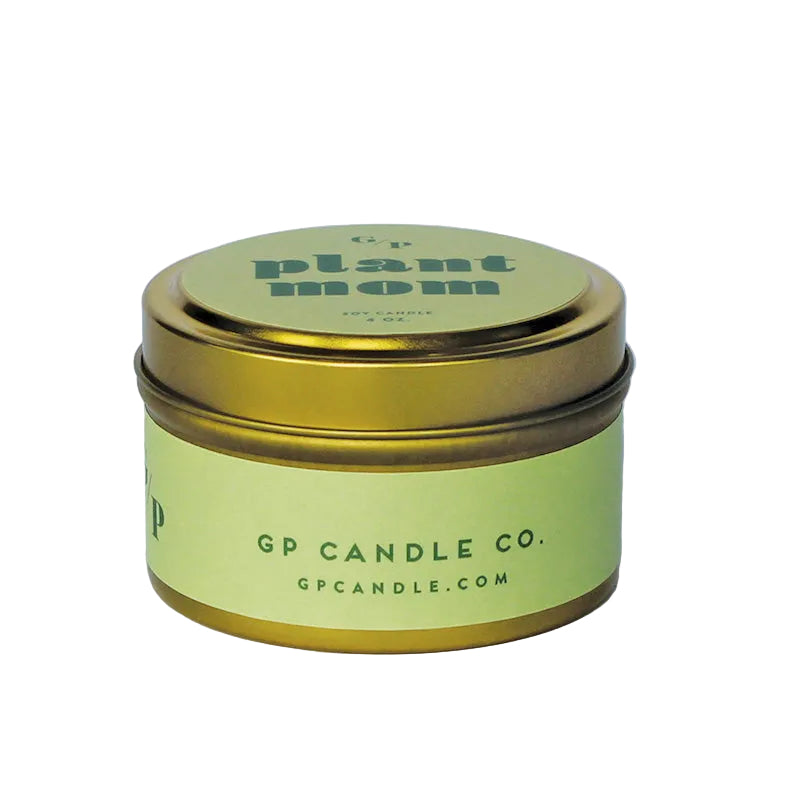 Sideview of 4 oz. green candle tin with gold lid featuring 'plant mom' text and GP Candle Co. logo on the side.
