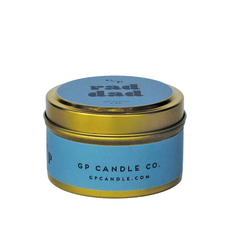 Sideview of 4 oz. deep blue candle tin with gold lid featuring 'rad dad' text and GP Candle Co. logo on the side.