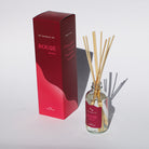 GP Candle Co. Rouge diffuser with packaging on a white background casting shadows in sunlight.